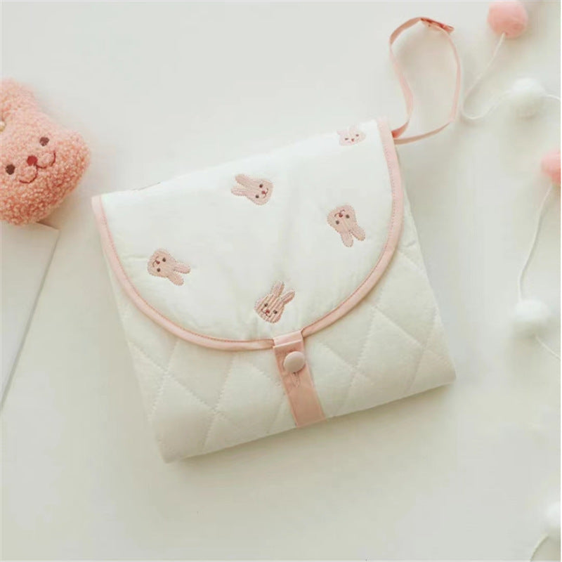 Compact baby diaper mat with soft padding for comfort